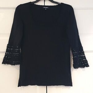 Black light  sweater top   by 525 America .